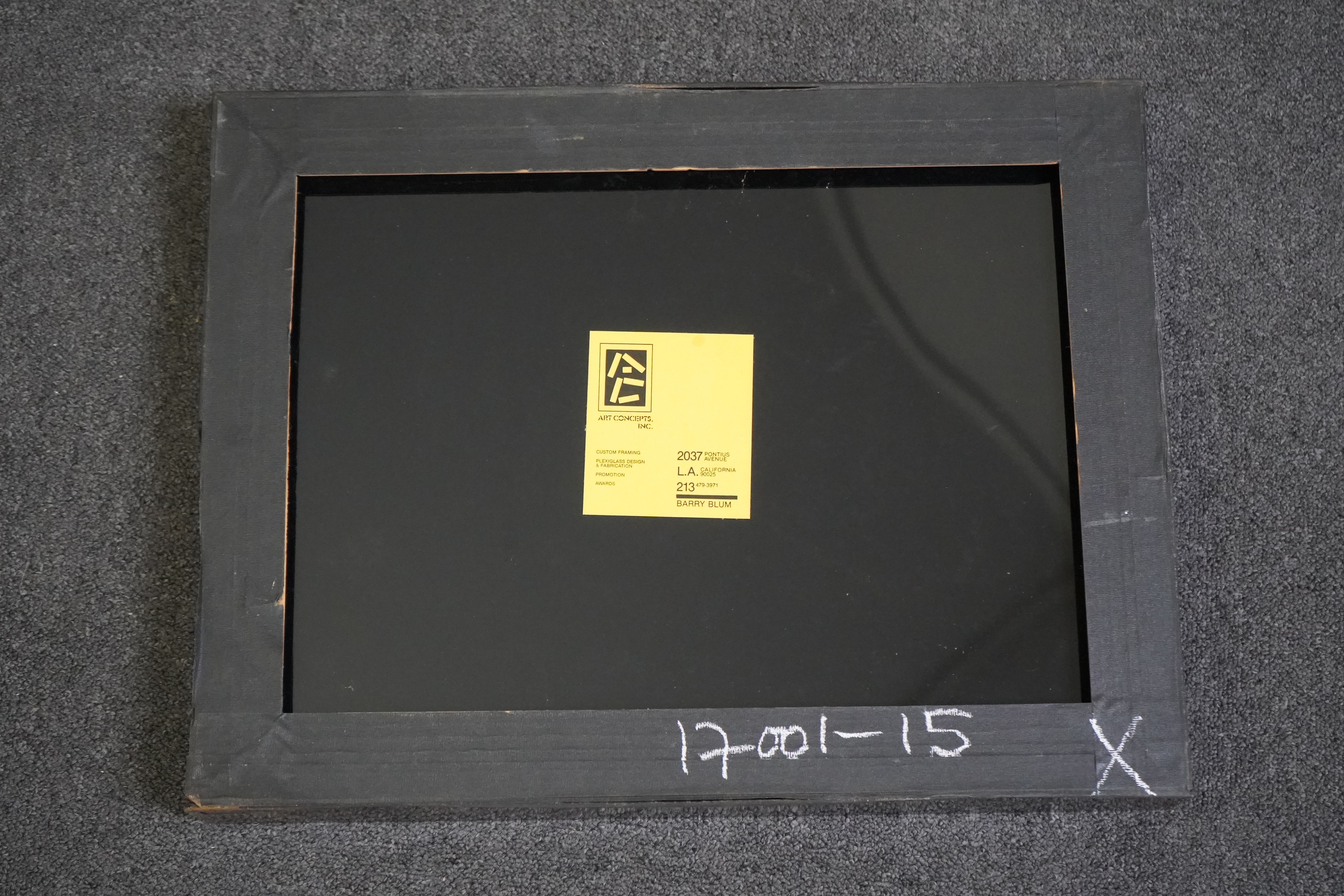 A clapperboard for A & B Camera for the film Hamburger Hill, framed and glazed.